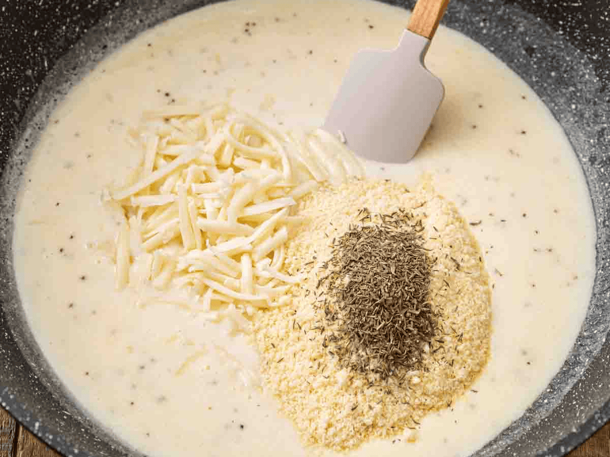 Bechamel sauce being made in pan.