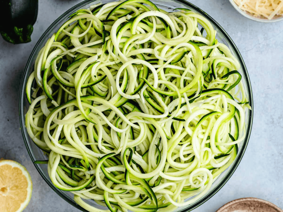Spiralized zucchini in large bowl.