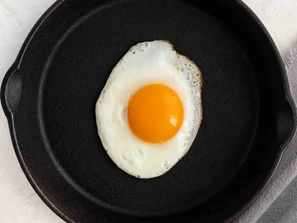 One egg cooking in pan.