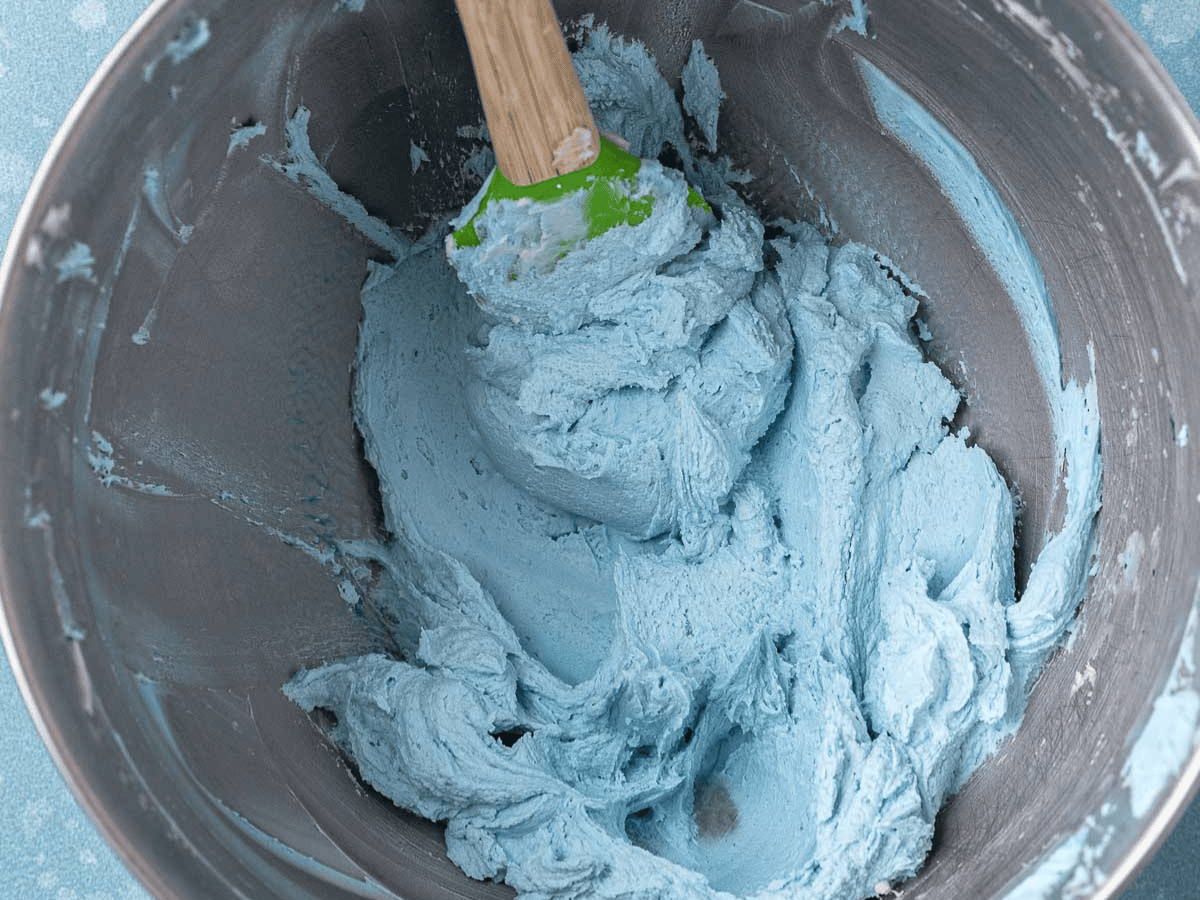 Blue frosting in mixing bowl.