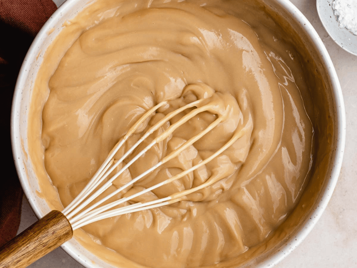 Mixing bowl filled with custardy dessert.