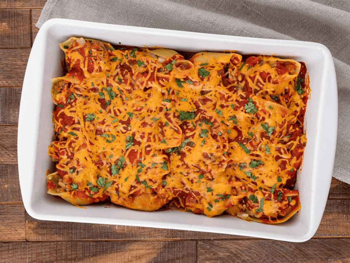 Baked pasta shells filled with meat mixture and topped with cheese.