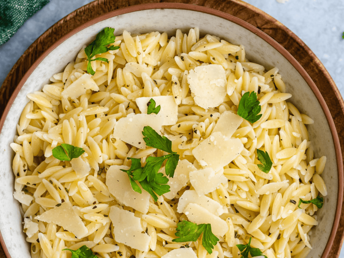 Top view of pasta dish in a cream bowl.