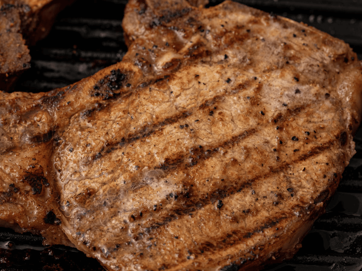 Close up of pork fillet on grill.