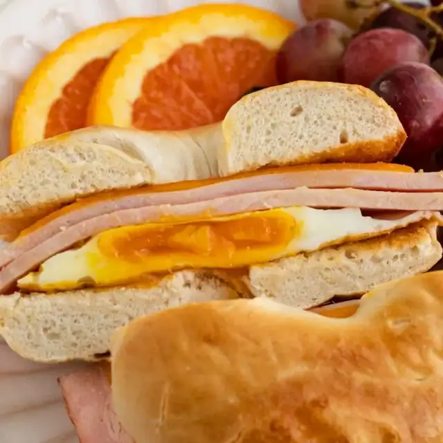 Breakfast sandwich with ham, egg, and cheese.