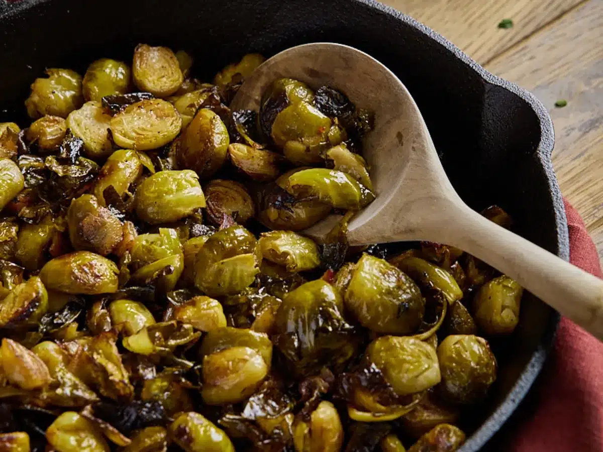 Grilled Brussels sprouts in cast iron pan.
