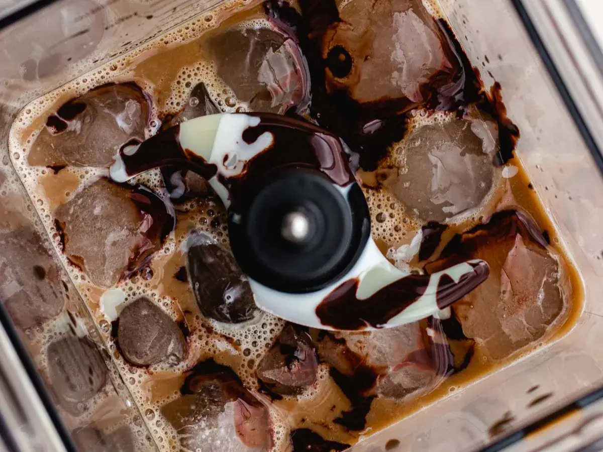 Ice, coffee, milk, chocolate syrup, etc. unblended in blender.