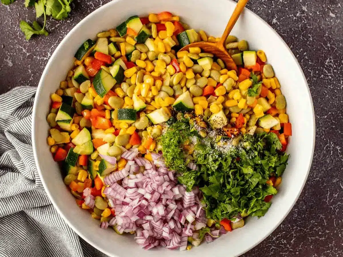 Corn and other diced vegetables in a bowl.