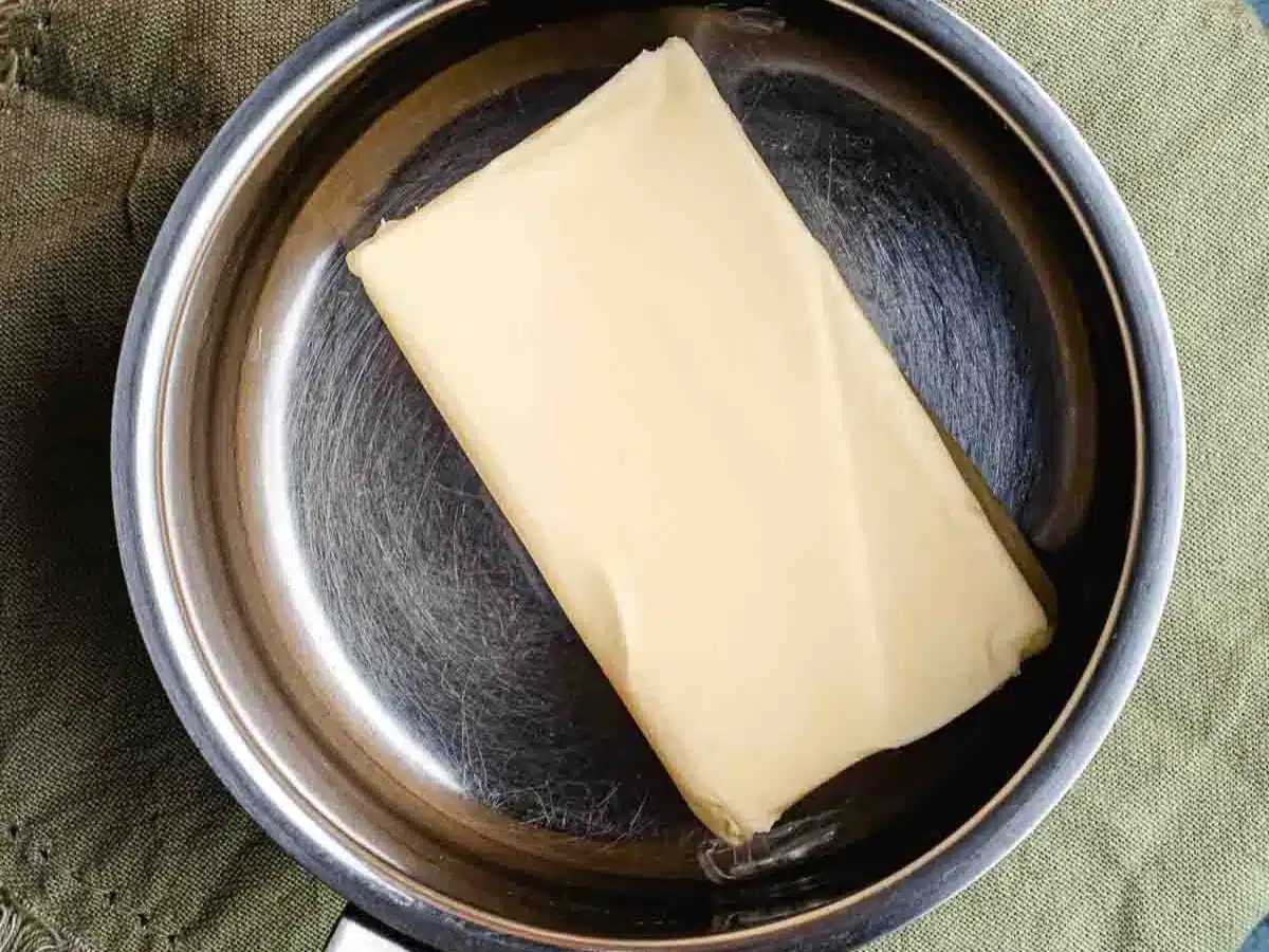 Large stick of butter in pan.