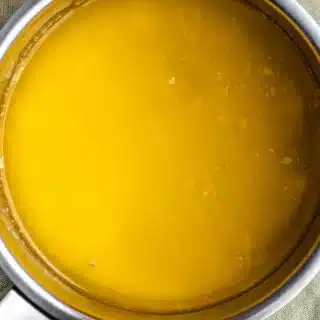 Melted butter in pan.