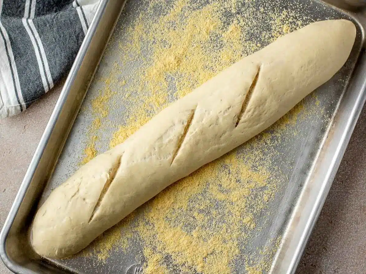 Long baguette shaped bread ready to bake.