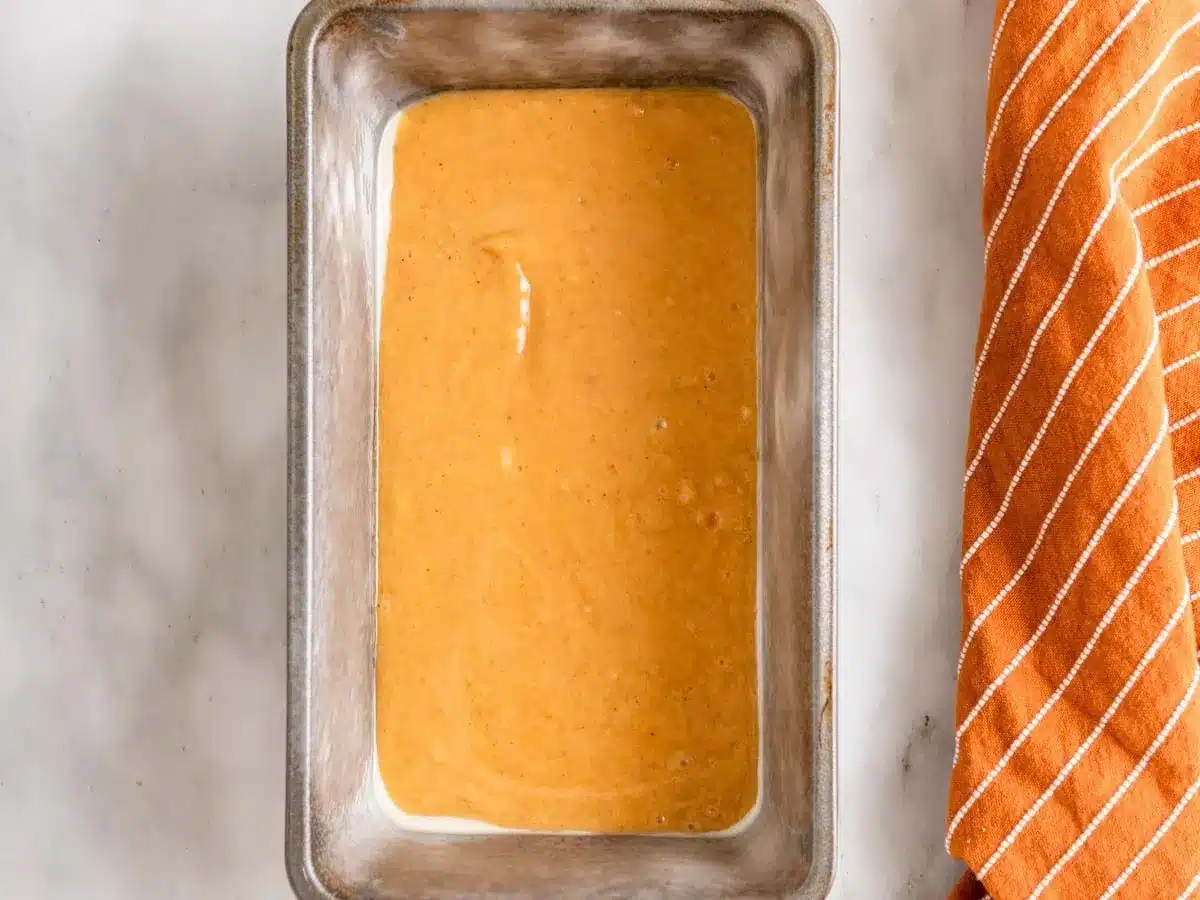 Layer of pumpkin batter in bread pan.