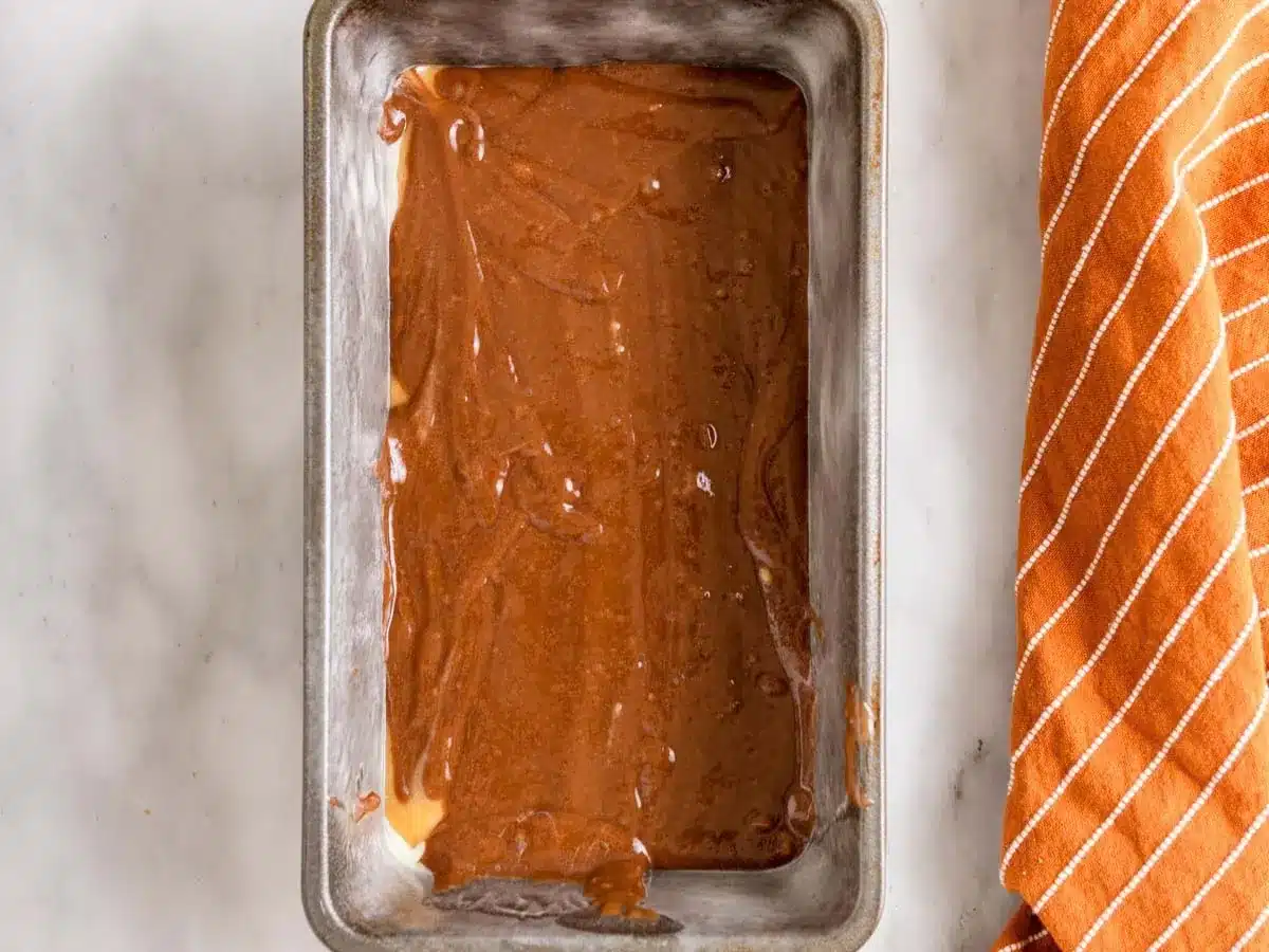 Layer of chocolate batter in bread pan.