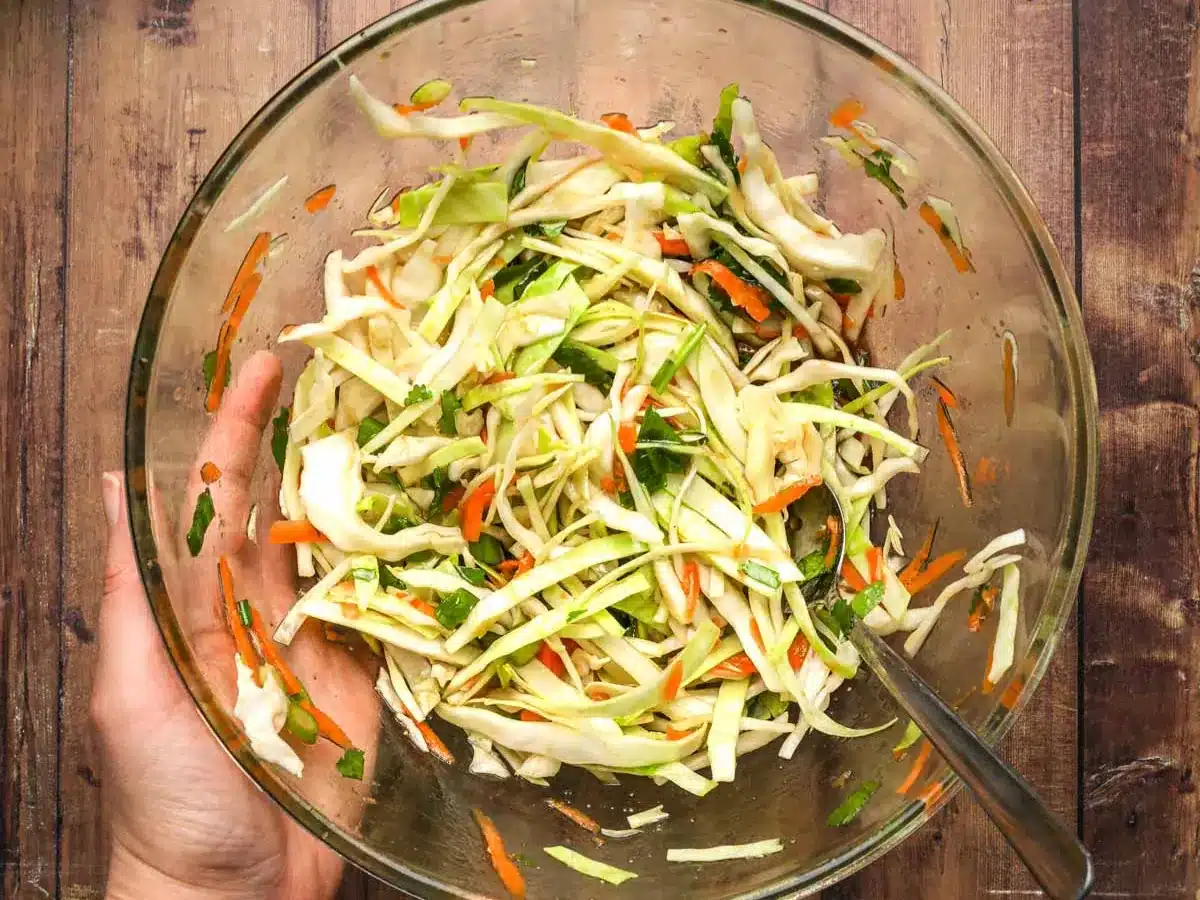 Julienned vegetables in large glass bowl.